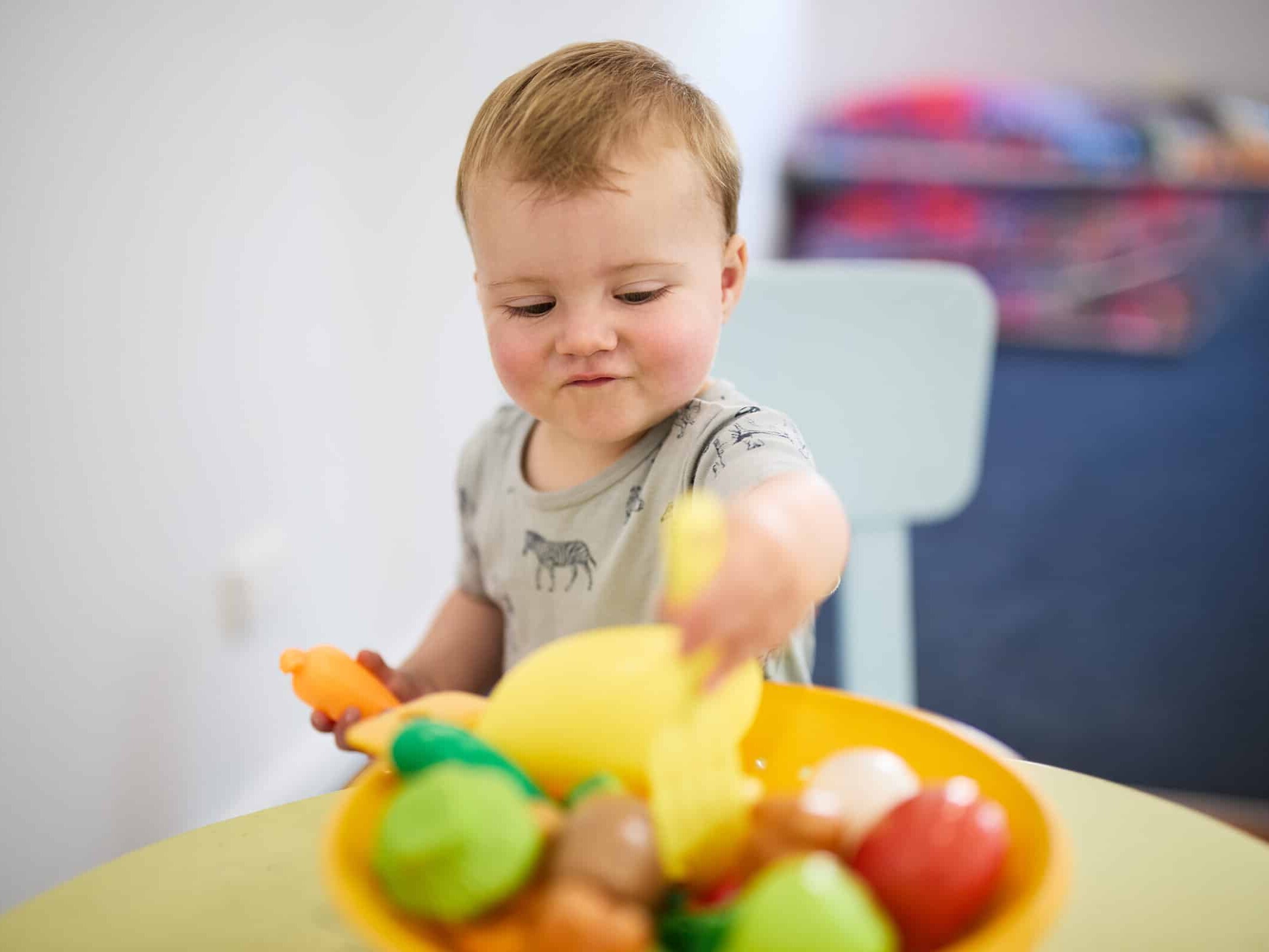 Playgroup Tasmania Child Playing with Fruit Bowl